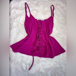 Hot pink flowly shirt has lace up corset look in the front size medium